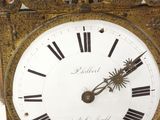 a clock that has roman numerals on the face of it