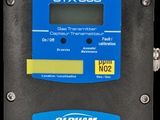 a close up of a digital temperature controller on a black background