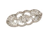 a silver broochle with diamonds on it