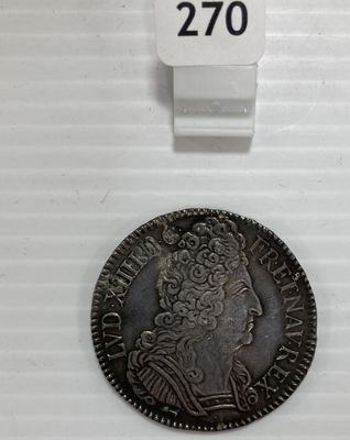 une pièce d'argent portant une tête de femme et une couronne