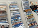 many different types of cds and dvds on the table