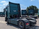 many trucks parked in a parking lot near each other