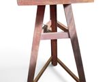 an image of a small wooden table with a book on top of it