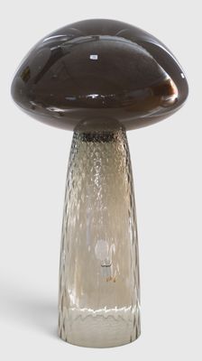 a glass mushroom with a brown base on a white background