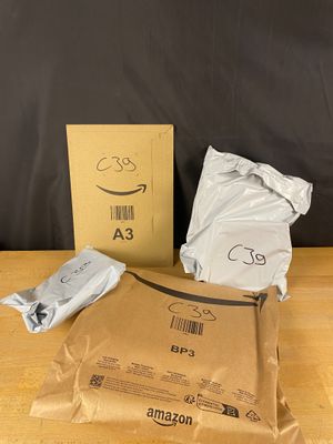 an amazon box and a package of amazon products sitting on a table