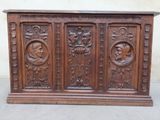 an old wooden cabinet with carvings and carvings on the doors