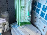 many bags of toilet paper on the shelf in the store