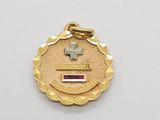 a close up of a medal with a cross on it