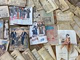 a pile of old newspaper papers on the floor