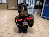 a motorcycle that is sitting on the floor in a building