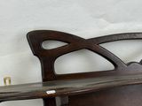 a wooden bench that has a wooden seat on top of it