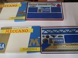a lot of different types of train sets on the table