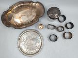 a lot of silver items that are on the table