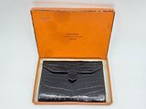 a box with a wallet inside of it on a table