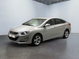 the silver car is parked in a large room with a white wall