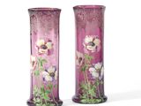 two vases with flowers painted on them on a white background