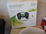 a box on top of a toilet in a bathroom
