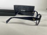 the glasses are on the table next to a box and a pair of scissors