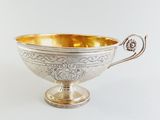 silver plated footed bowl with ornate design and handles