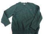 the sweater is green and has a small patch on the chest