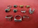 a lot of rings that are sitting on a red surface