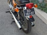 a motorcycle that is parked on the side of the street