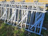 a lot of metal bars that are sitting in the grass