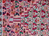 a pink and blue rug with a pattern on it