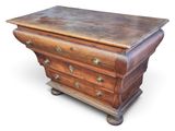 an old wooden chest of drawers on casteors on a white background