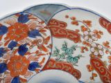 a plate with a design of flowers and birds on it