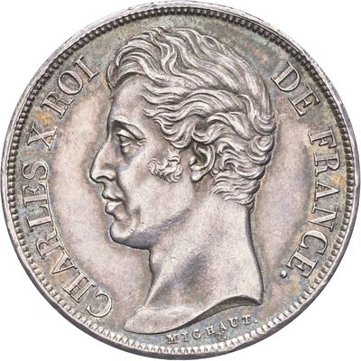 une vieille pièce d'argent avec un visage de femme dessus
