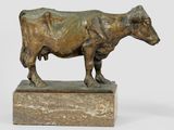 statue of a cow standing on a marble base on a white background