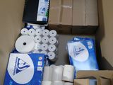 many rolls of toilet paper in a cardboard box