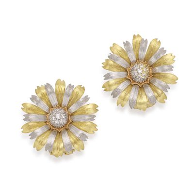 a pair of diamond and gold flower earrings