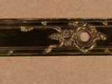 a brass plate with a design on it on a table