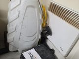 a white container with a yellow hose next to a white container with a yellow hose