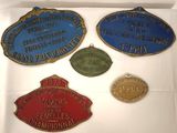 several different types of plaques are displayed on a white surface