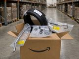 an amazon box with a pair of headphones in it in a warehouse