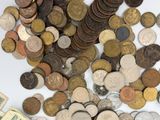 a pile of coins and money sitting on a table