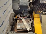 an image of a lawn mower with a battery in it