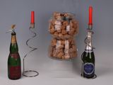 bottles of wine and a candelab are sitting next to a candelab