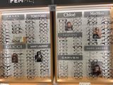 many pairs of glasses on display in a store window