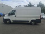 a white van that is parked in a parking lot