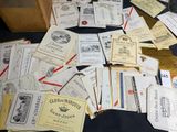 a lot of wine labels on a black table