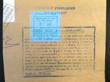un gros plan d'une carte postale sur laquelle est apposé un timbre