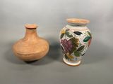 two vases sitting next to each other on a table