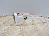 a white pair of sunglasses sitting on a woven basket