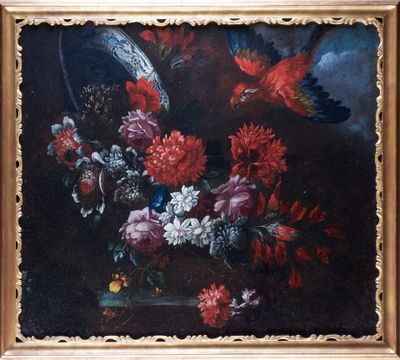 painting of flowers and birds in a gold frame on a black background