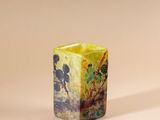 an image of a small square vase with a painting on it