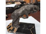 an image of a statue of a ram on a marble base